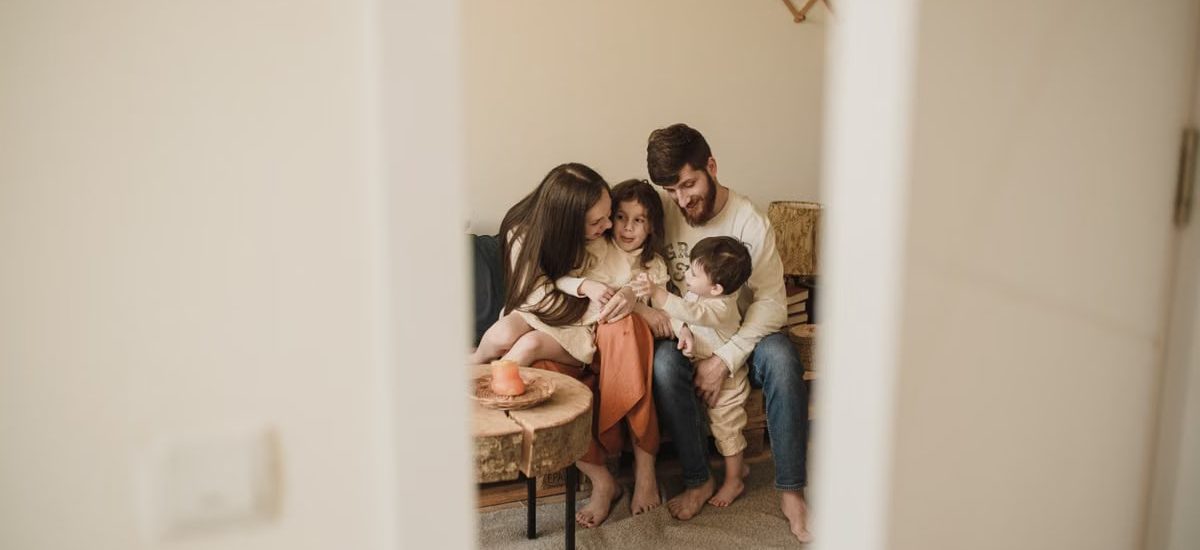 A loving family enjoying a warm, intimate moment together indoors.
