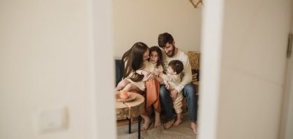 A loving family enjoying a warm, intimate moment together indoors.